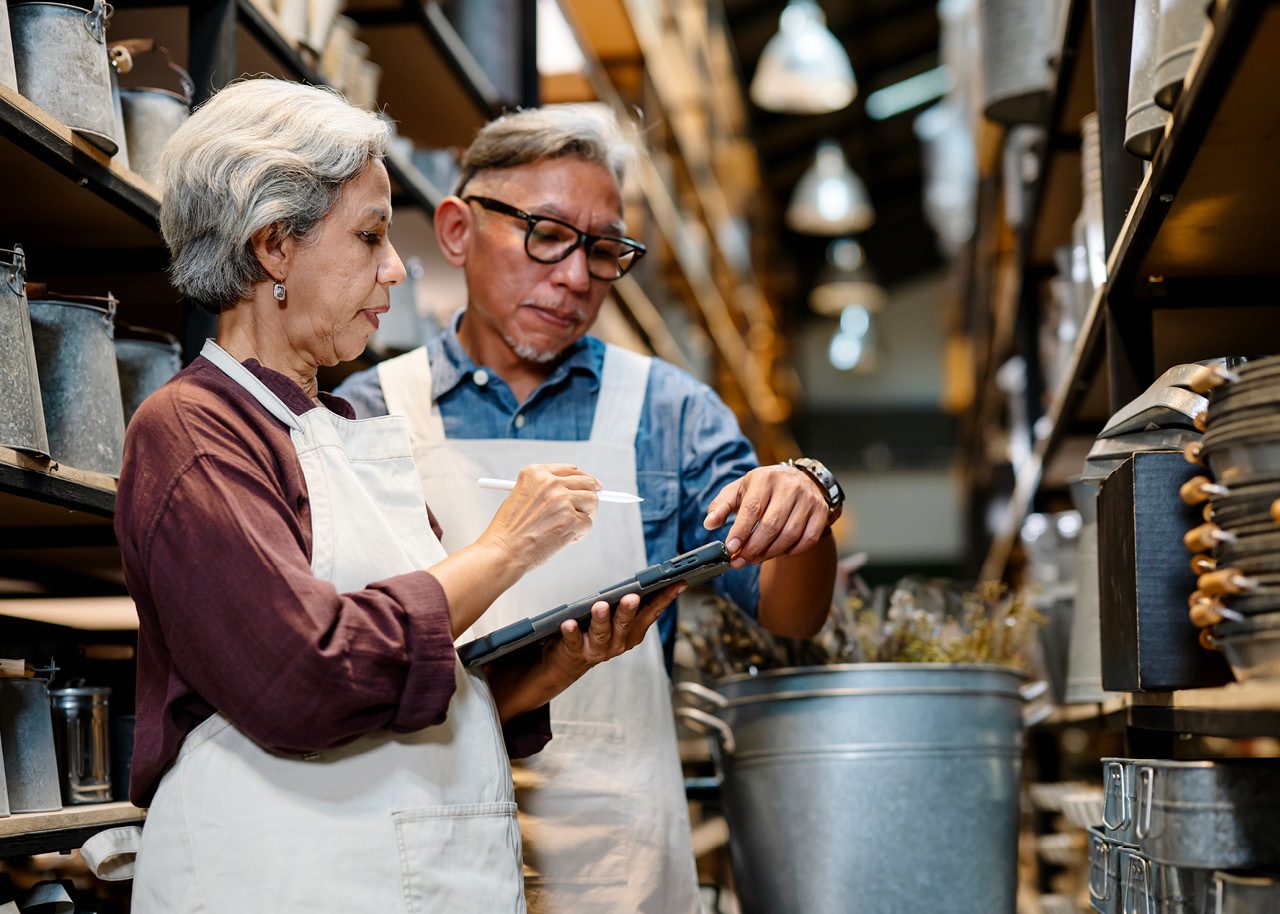 Small business owners confirming orders